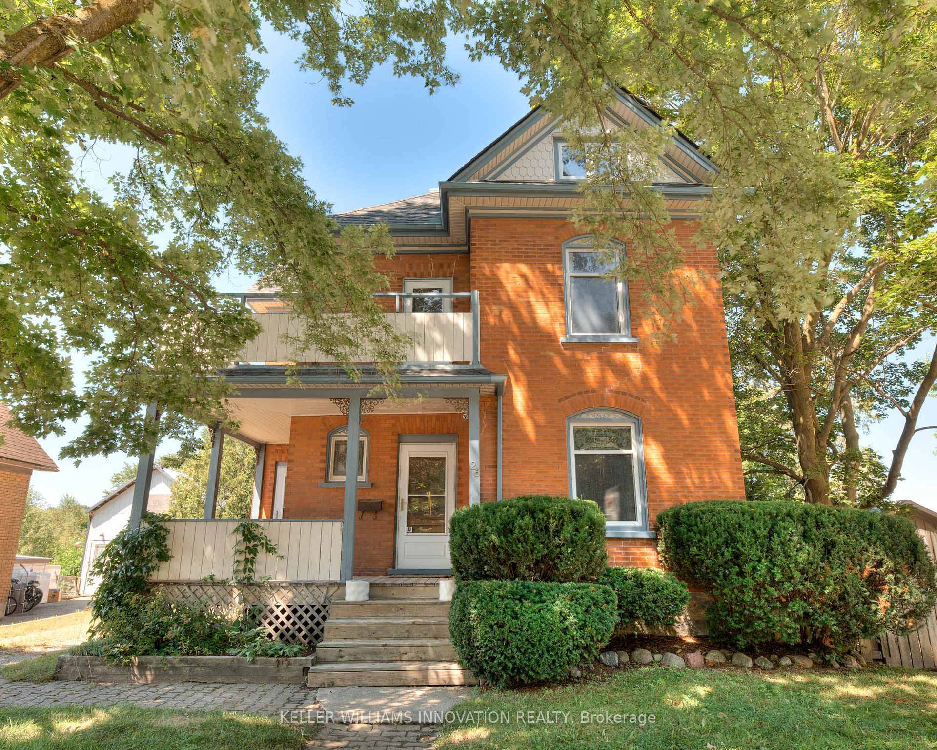 Welcome to 26 Arthur Street N, a striking century home where timeless red brick and original woodwork meet bold, modern design.