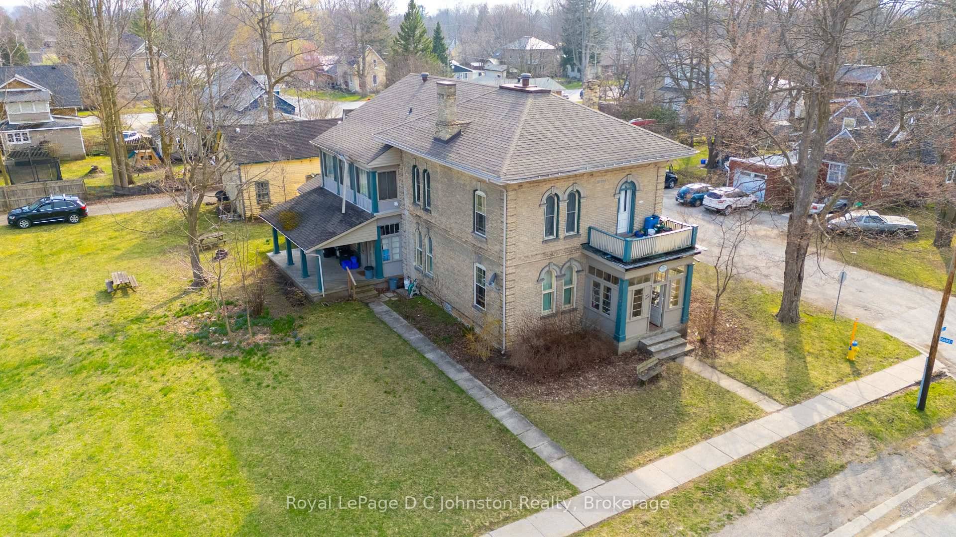 Attention Investors ! Seize a unique opportunity in Port Elgin with this fully tenanted fourplex nestled within a distinguished century home.
