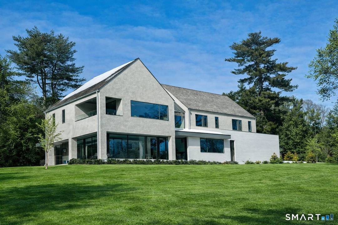 Designed by custom home builder Vita Design, this exciting newly constructed modern residence is a refined architectural statement that balances scale and light, capturing direct 5 Mile River views and ...