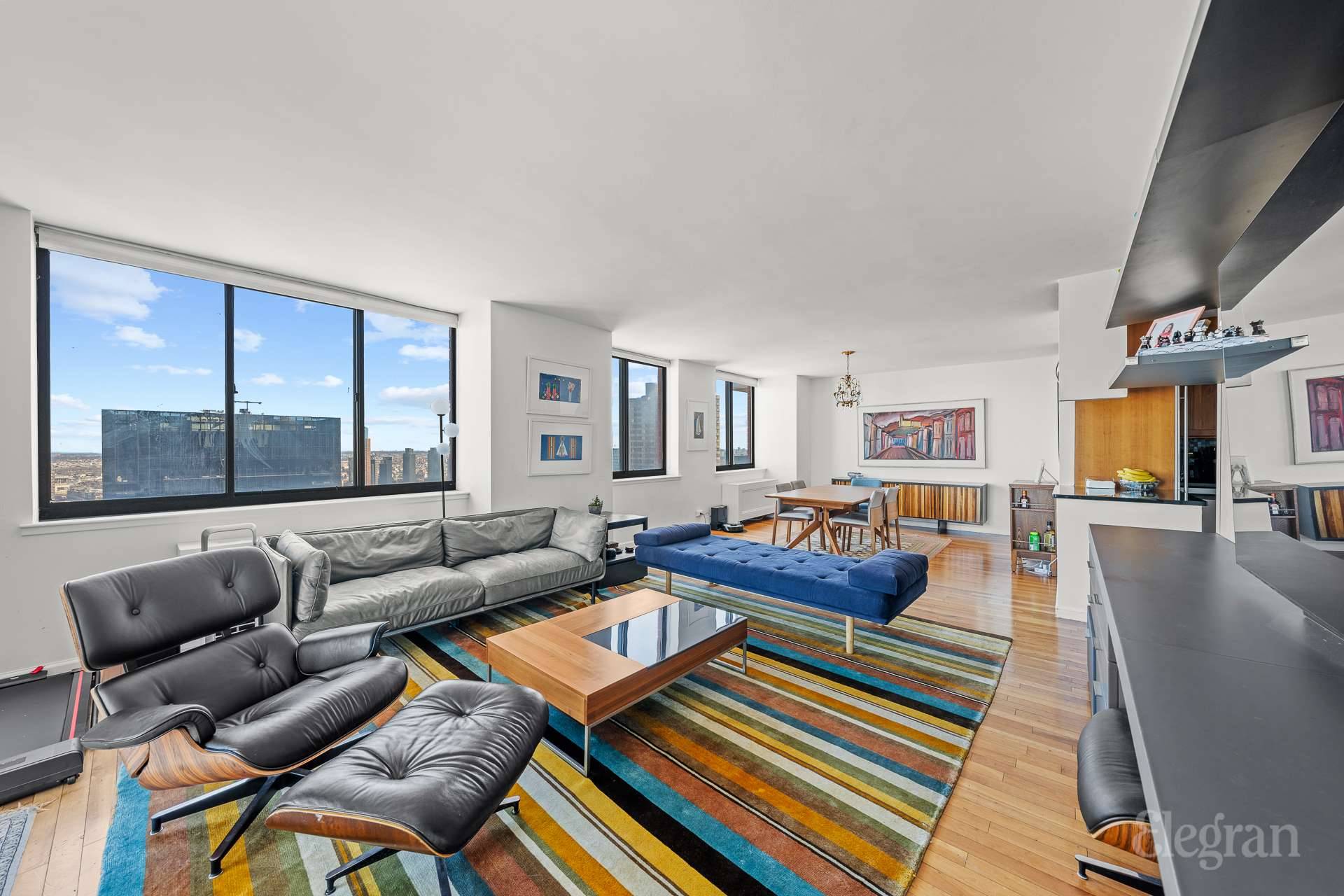 Sprawling Sun Flooded High Floor Condo with 2 Balconies and Spectacular Skyline and River Views.