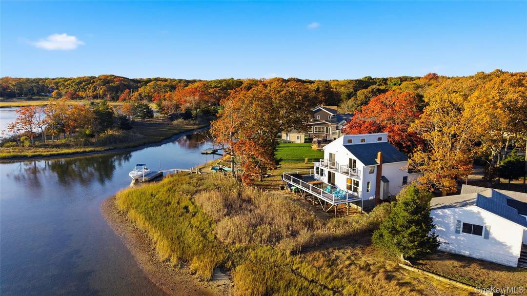 Wake up to breathtaking panoramic views of Peconic Bay from your own private waterfront retreat !