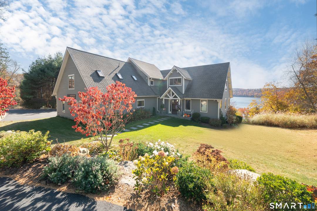 This stunning, private, lake club home offers incredible views of Candlewood Lake, featuring picturesque western exposure with breathtaking sunsets.