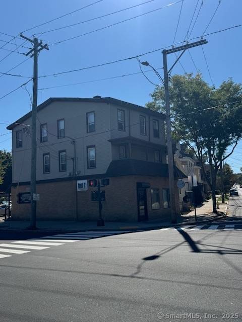 Mixed use property featuring 4 residential units and 1 commercial space in a prime New Haven County location.