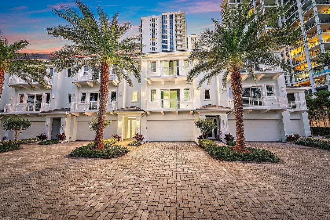 An elevated expression of coastal living, this three story Water Club Villa offers refined luxury with a private elevator and sweeping Intracoastal Lagoon views.