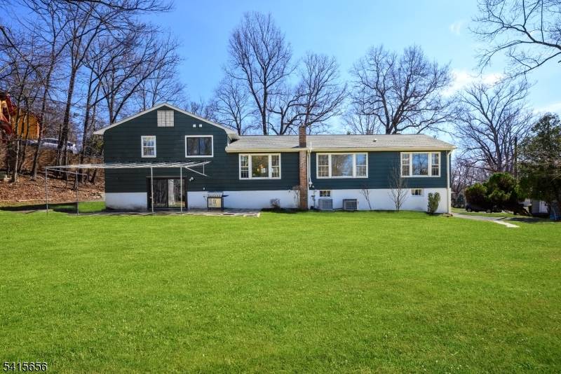 Tucked away on a quiet cul de sac and set on over half an acre of beautifully flat property, this expansive Scateri split level residence offers space, warmth, and a ...