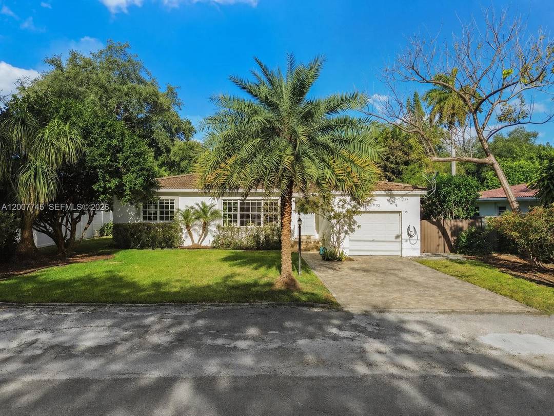 Welcome to this completely updated Biscayne Park pool home, perfectly designed for effortless indoor outdoor living and entertaining.