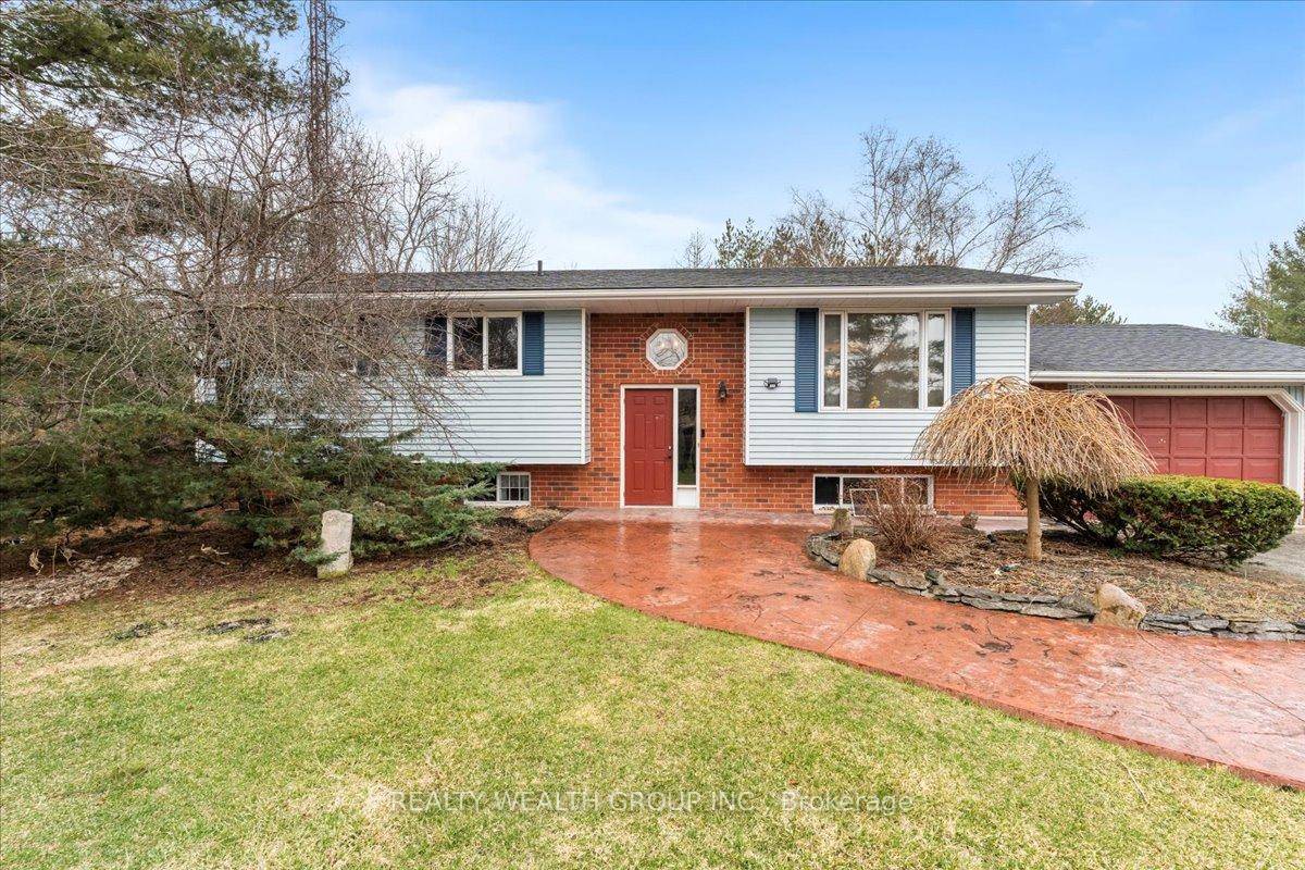 Charming Country Bungalow on Nearly 2 Acres in Sought After Holloway Heights !