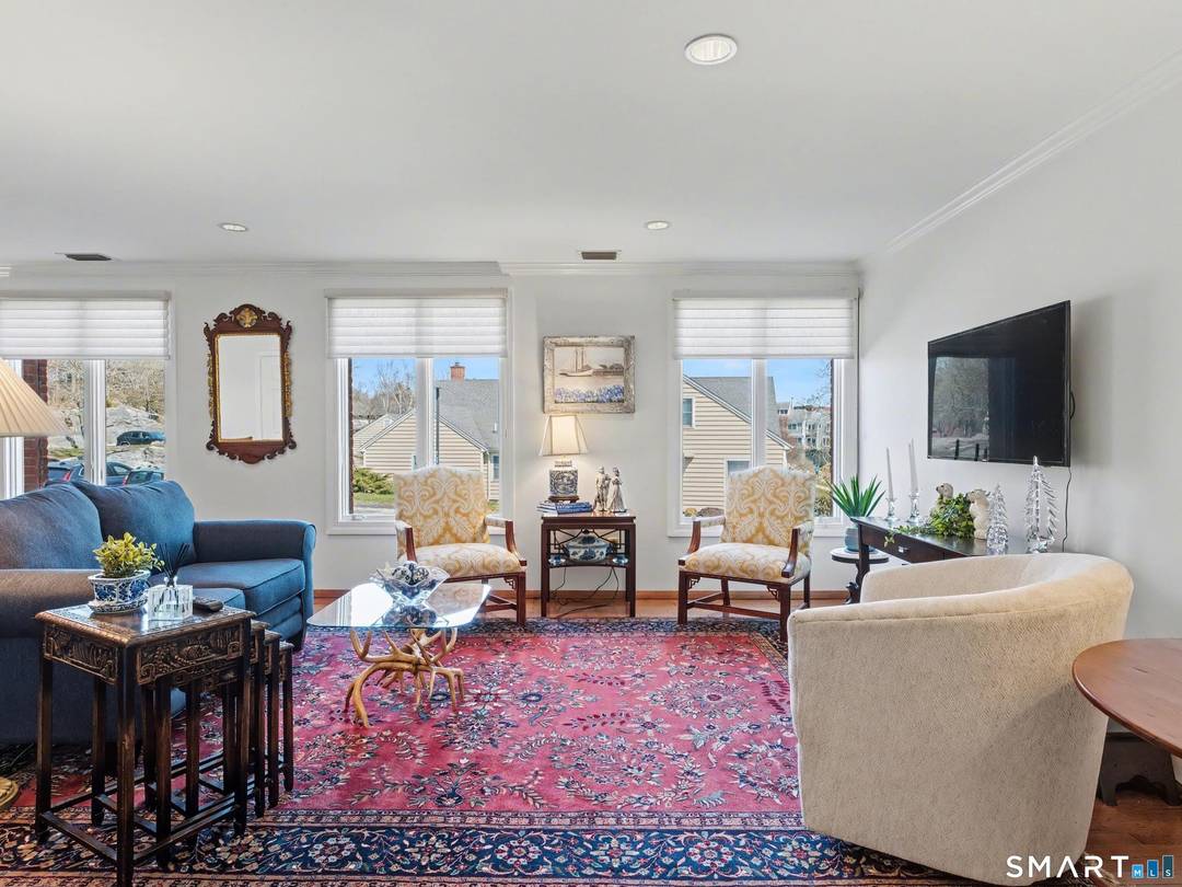 Direct Waterfront One Level Condo with Un Obstructed Water Views of the Mystic River.