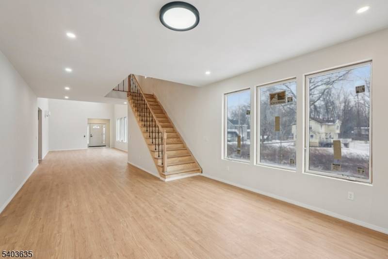 Welcome home to this newly constructed 3 bedroom, 3 bathroom Colonial nestled on a wooded lot in the heart of Wayne, where modern design meets everyday comfort.