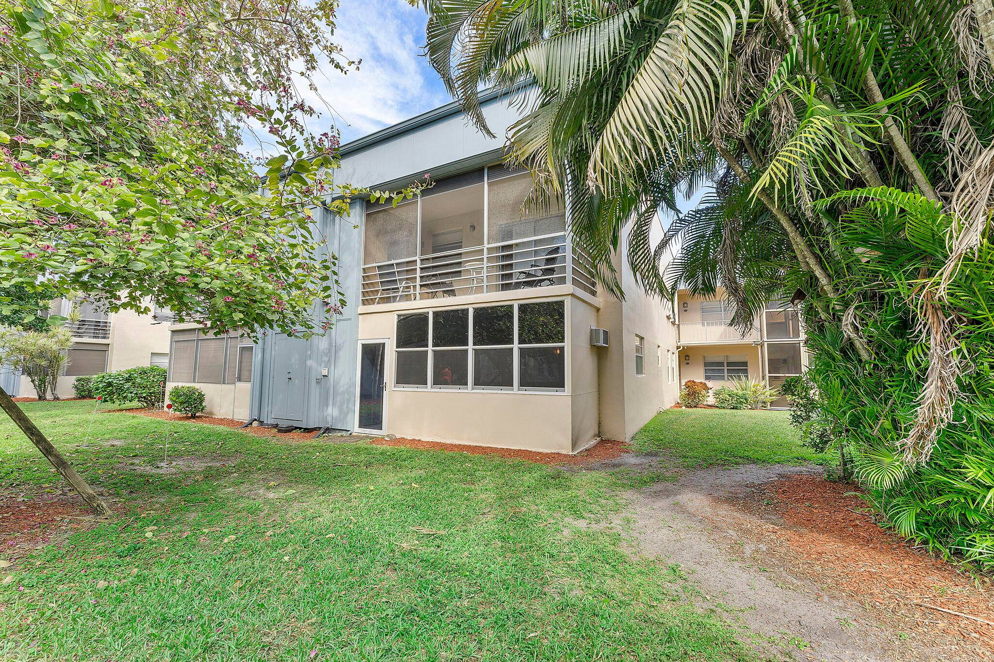 Light, bright, corner Two bedroom, two bath condo on the ground floor facing the garden.