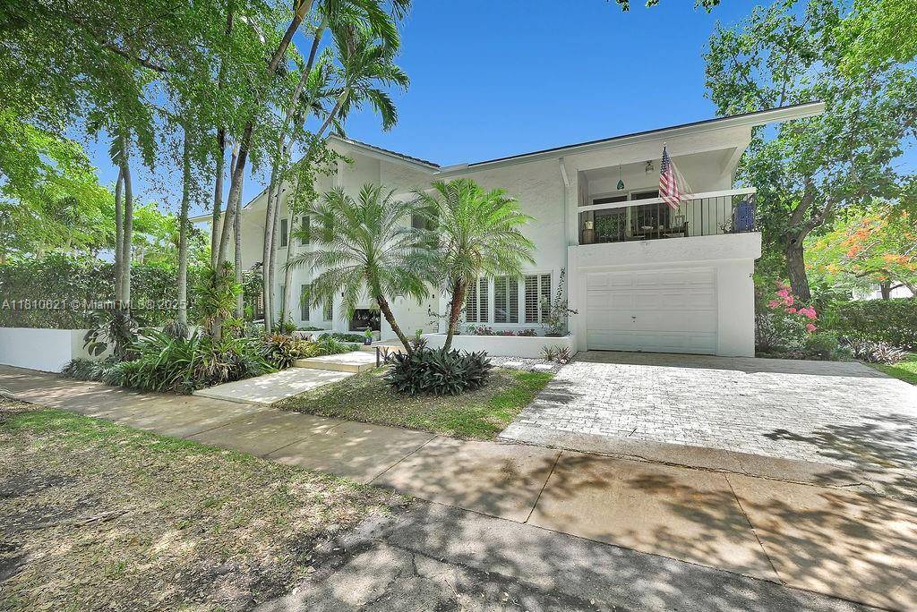 Located on a lush, tree lined corner lot in Coral Gables, this beautifully updated mid century modern home offers a perfect blend of timeless design and everyday comfort.