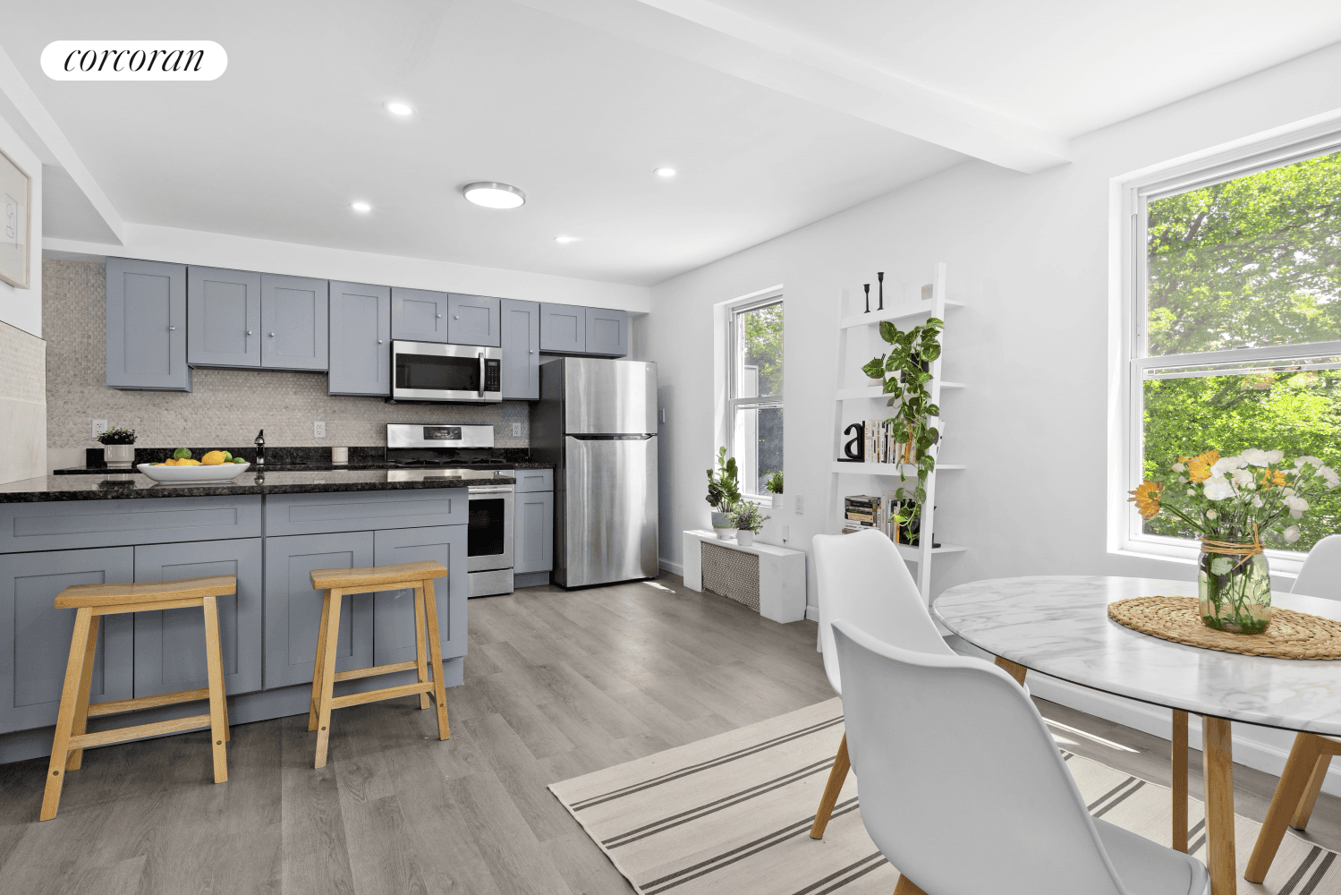 Welcome home to 21 E 4th Street a three story two family Townhouse, thoughtfully designed for flexible living, complete with an extra wide driveway and nestled on a serene tree ...