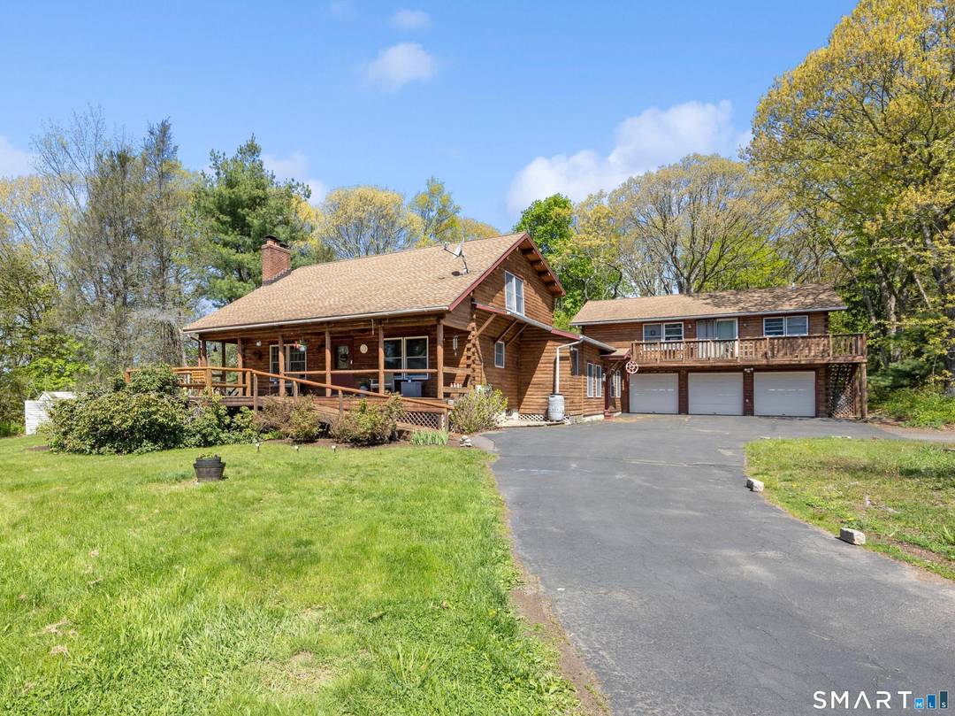 Private Log Cabin Retreat with Legal 2 Bedroom Accessory Dwelling Unit Income Potential Tucked away on 1.