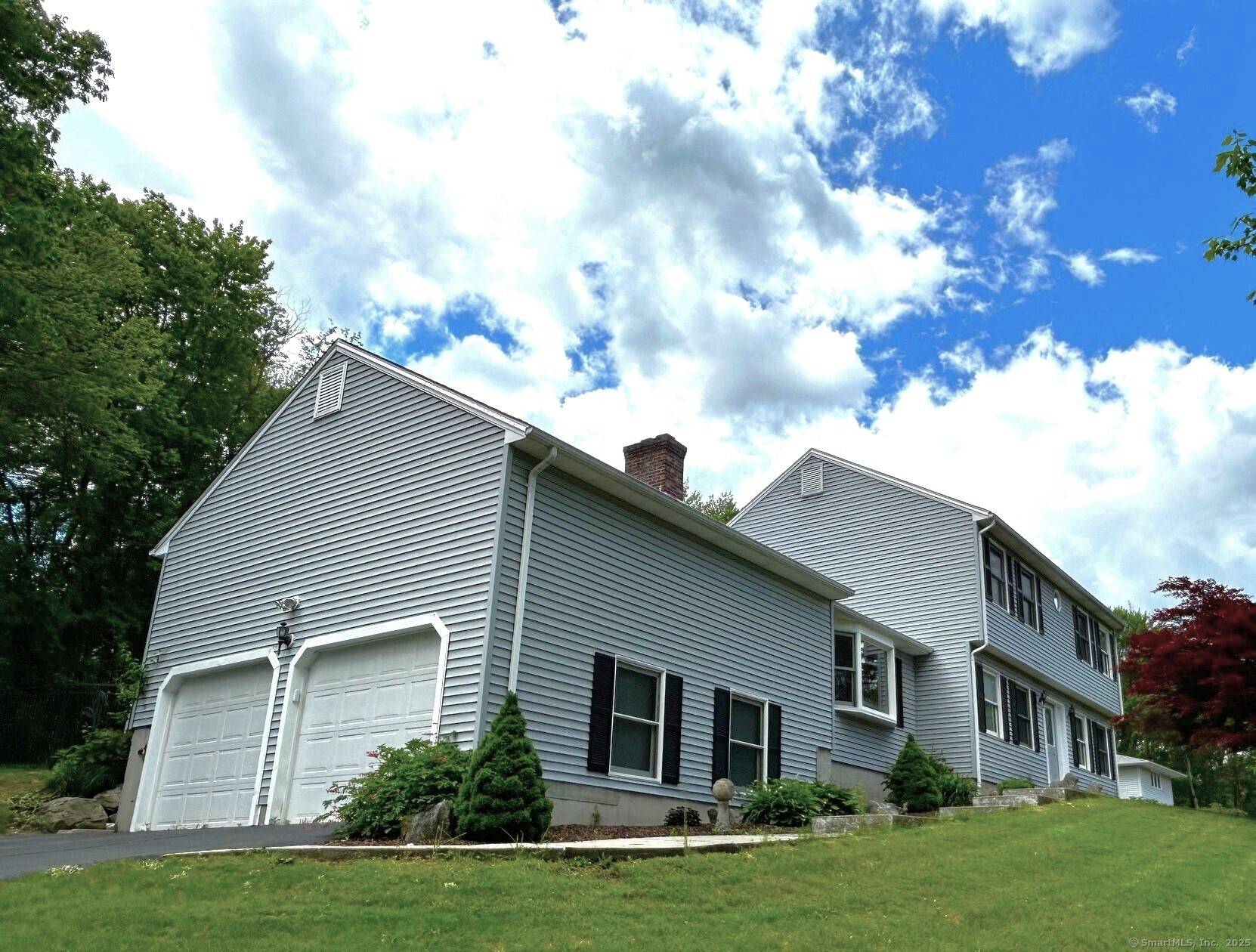 Welcome to this spacious and beautifully maintained traditional Colonial home on a 1.