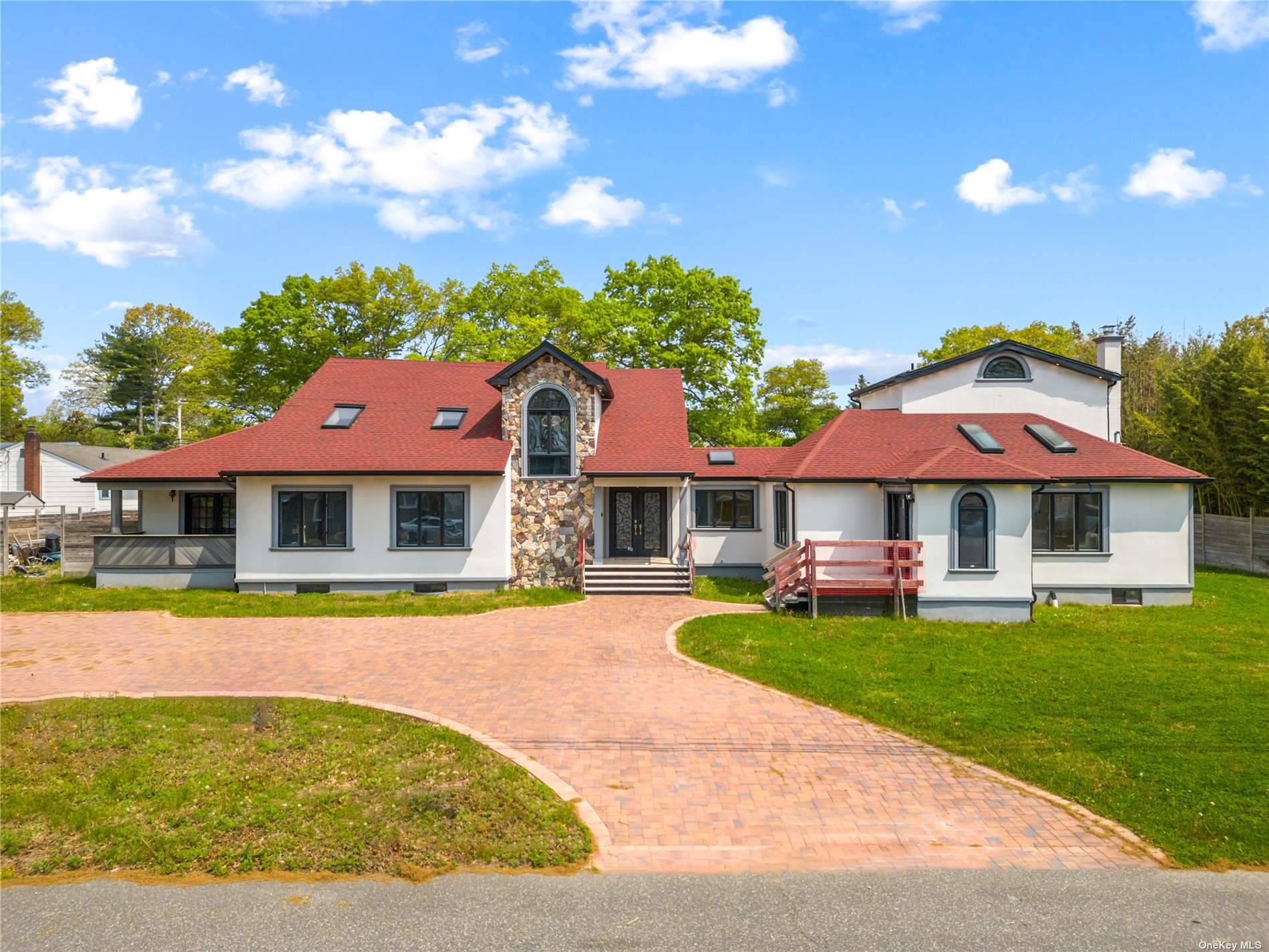 Contemporary colonial in an amazing pocket of Dix Hills.