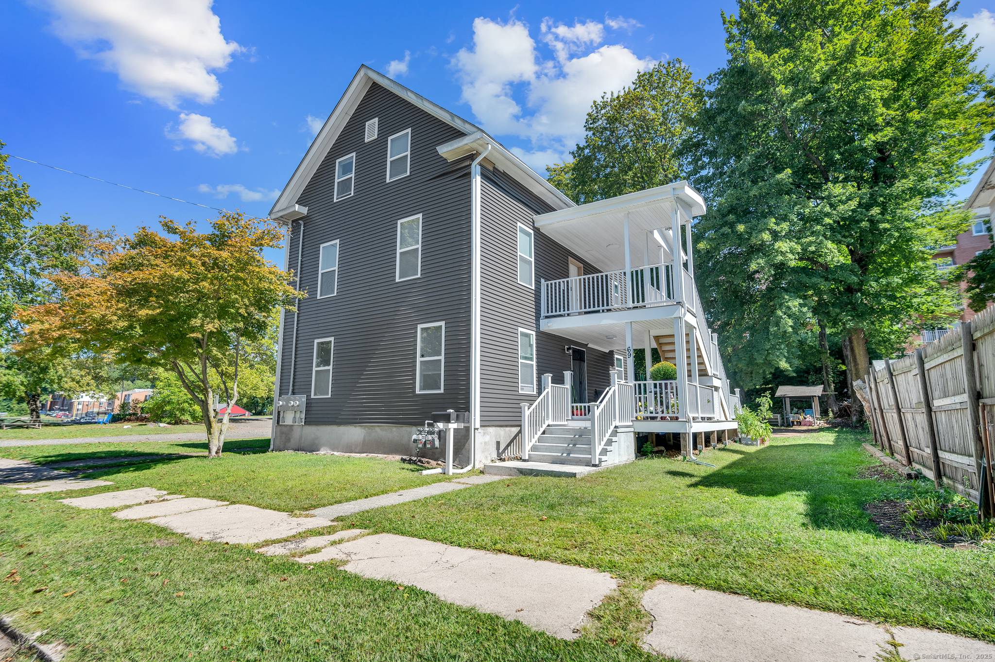 Welcome to 69 Putnam Street, a beautifully updated two family home.