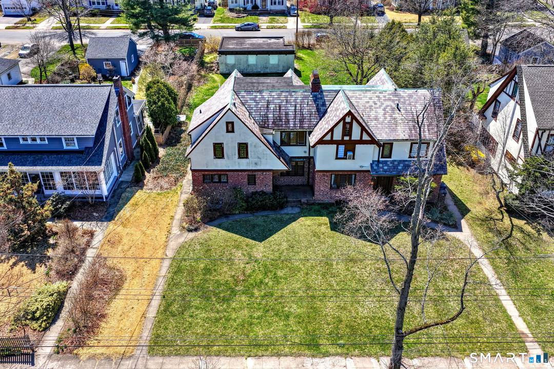 Exceptional opportunity to own a distinctive 1925 Tudor Revival Duplex in a highly desirable location.
