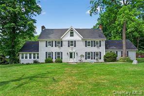 Charming Colonial with 4 Bedrooms on Nearly an Acre Prime Location !