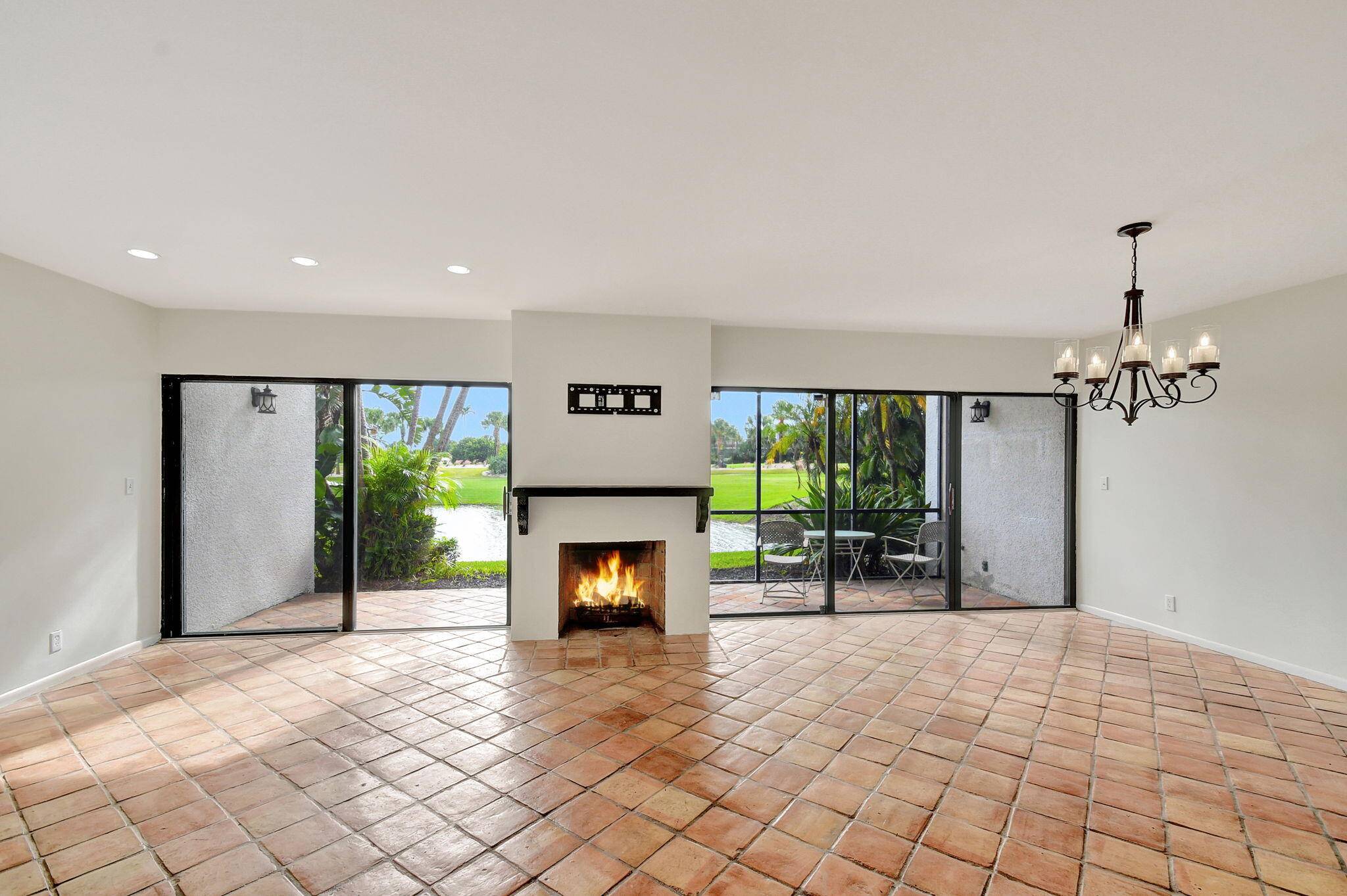Charming 2 bedroom, 2 bathroom Villa, covered parking for 2, kitchen boast granite countertops stainless steel appliances, Wood burning fireplace, second floor den could be 3rd bedroom, 2 screened lanai's ...