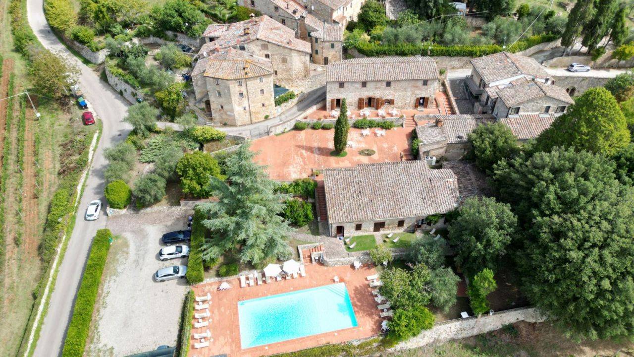 Ancient luxury property with pool consisting of a main villa and an annex with 10 bedrooms and 11 bathrooms for sale in Siena, Tuscany.