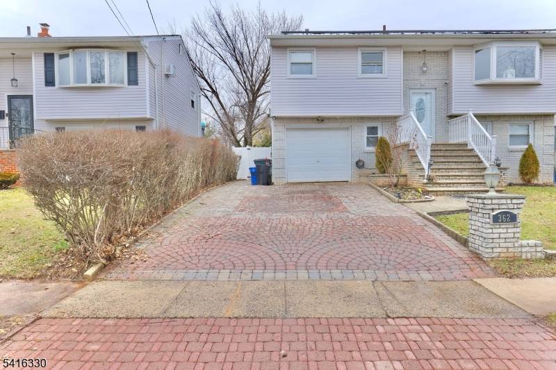 Welcome to this beautiful bi level home located in desirable Rahway, offering the perfect blend of space, comfort, and functionality.