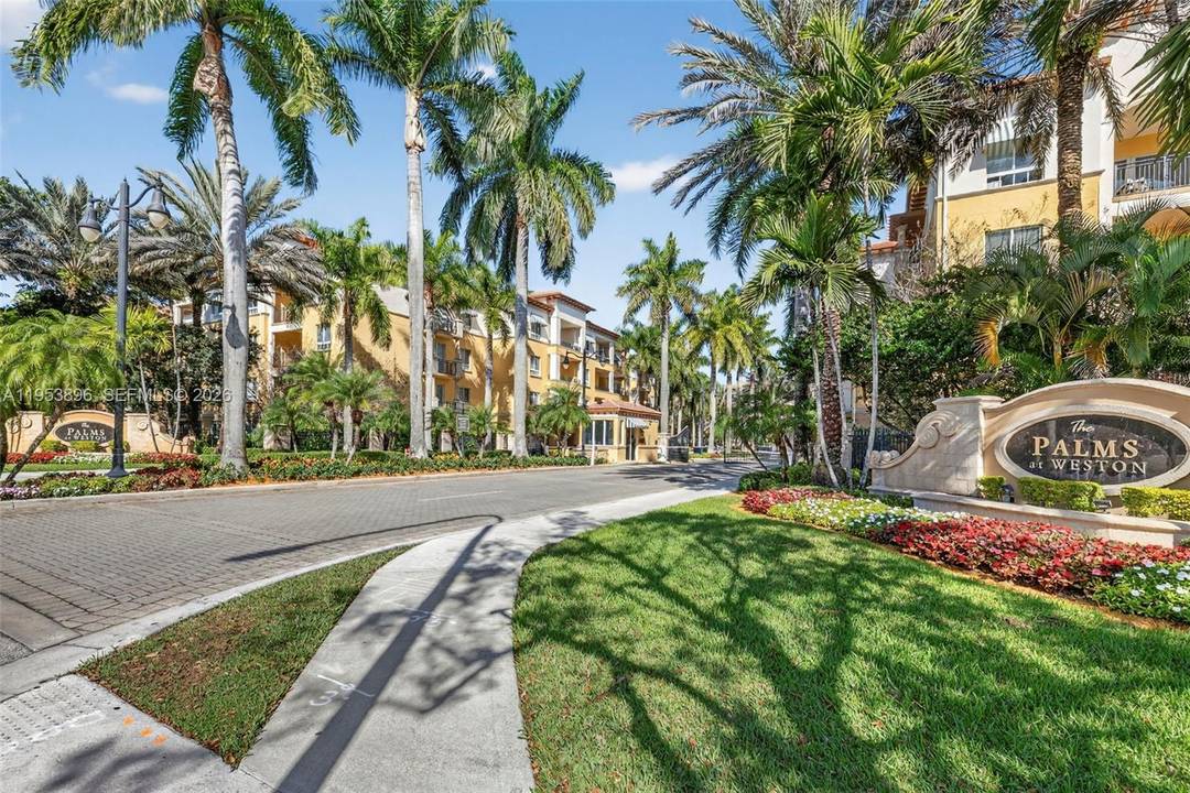 Welcome to this coveted first floor corner residence in the highly sought after, guard gated 55 community of Palms at Weston Island House.