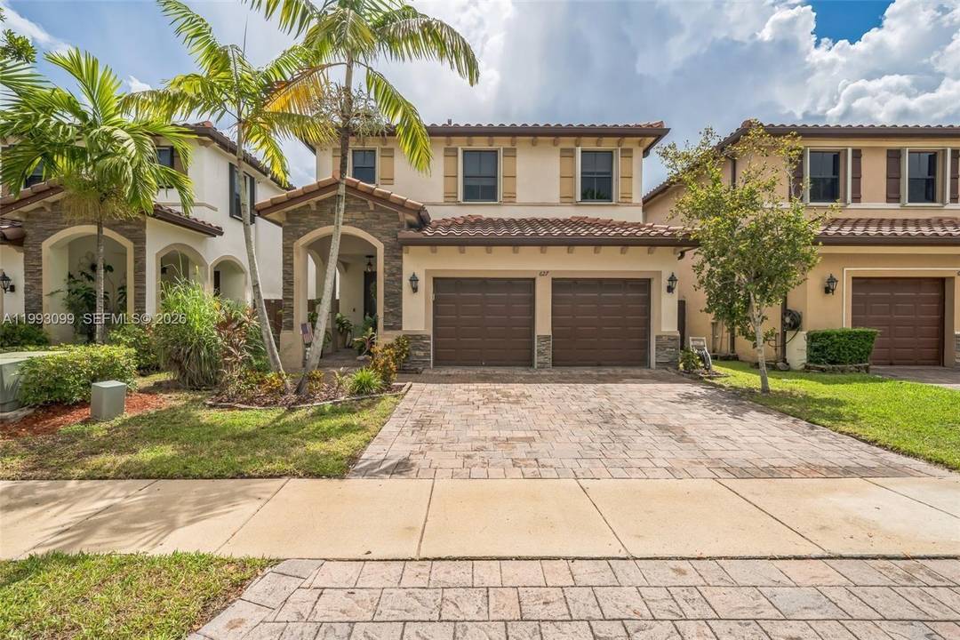 Spacious five bedroom home located in a gated community in Homestead with low HOA and a private backyard, perfect for comfortable living.