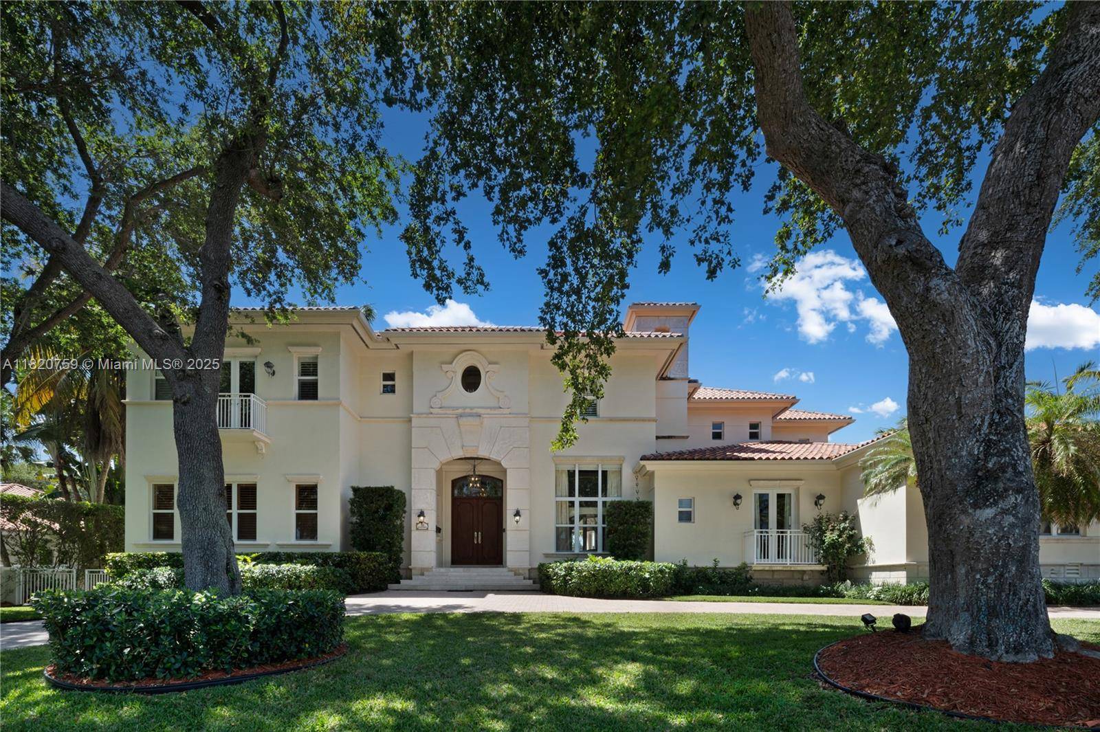 Elegant and expansive waterfront estate in guard gated Old Cutler Bay.