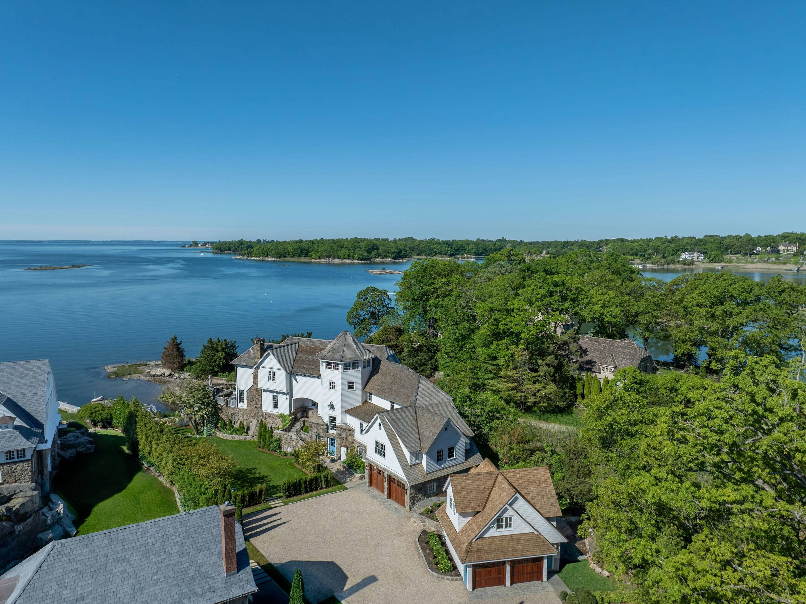 Welcome to 25 Tokeneke Trail, an exceptional waterfront residence in the private Tokeneke Association.