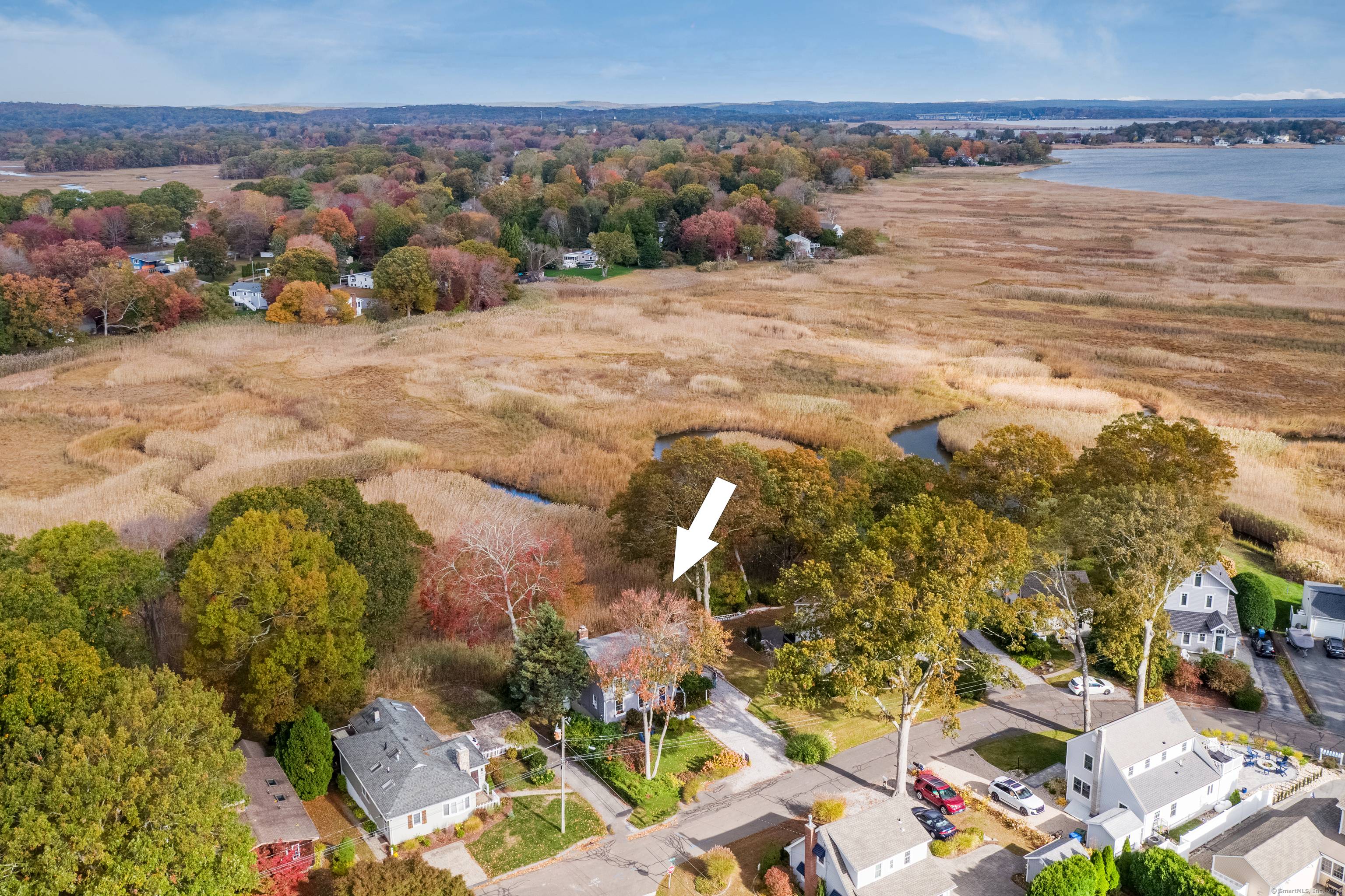 Enjoy coastal living in this delightful 3 bedroom home offering serene marsh views in Old Saybrook's sought after seaside enclave.