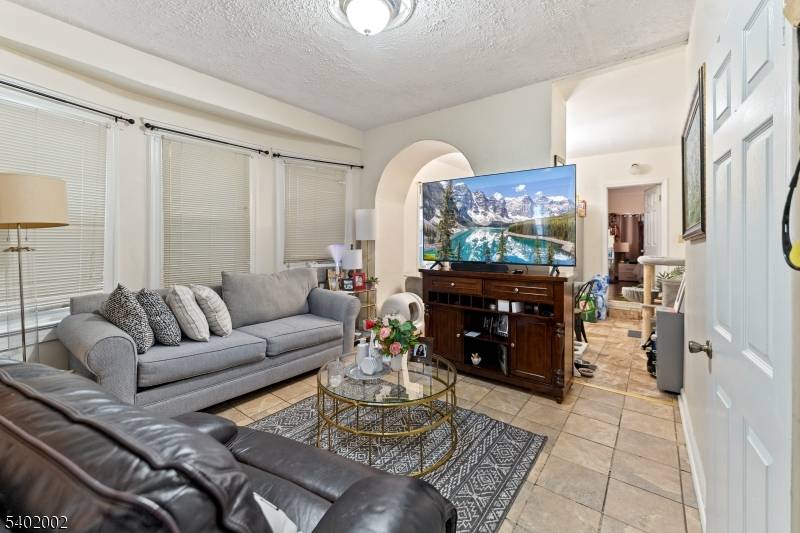 Welcome to this charming and well cared for two family home in desirable Jersey City !