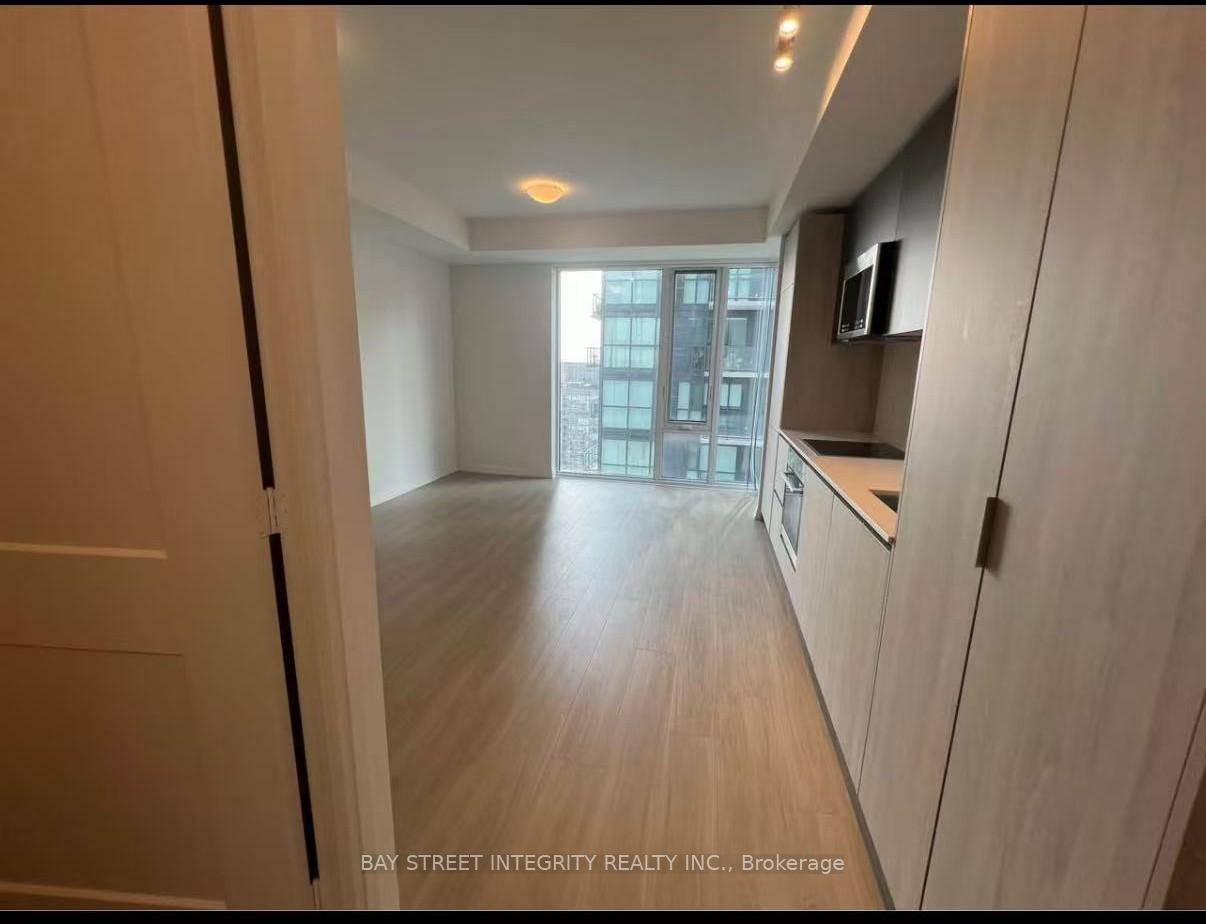 Experience elevated city living in this modern studio suite on the 45th floor of the newly built Plaza Theatre District condominium.