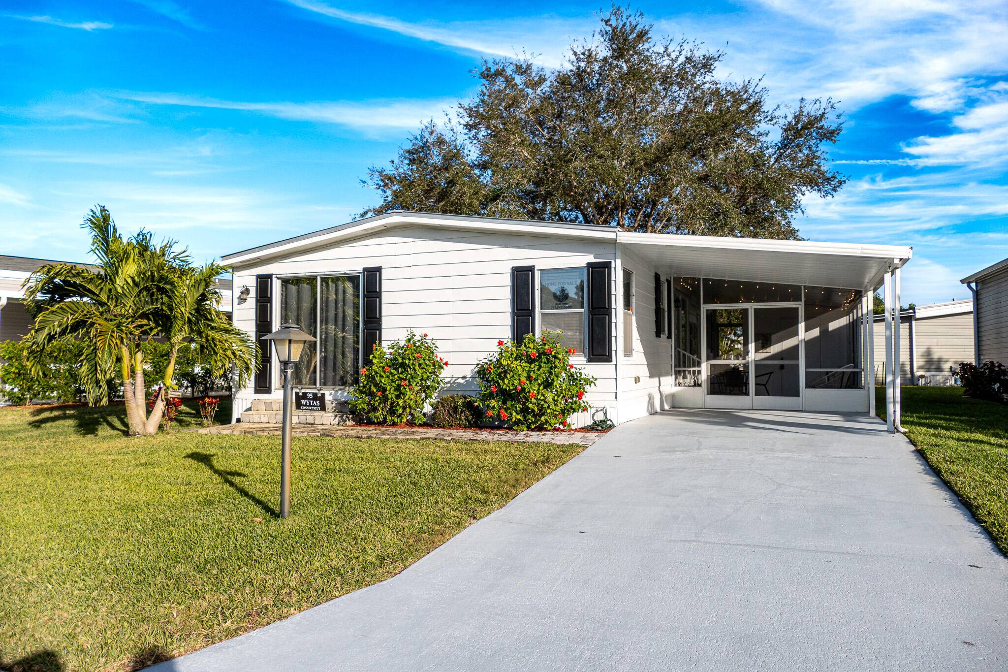 95 North Warner Drive is located in the 55 community of Pinelake Village in Jensen Beach and is a charming home that comes completely furnished.