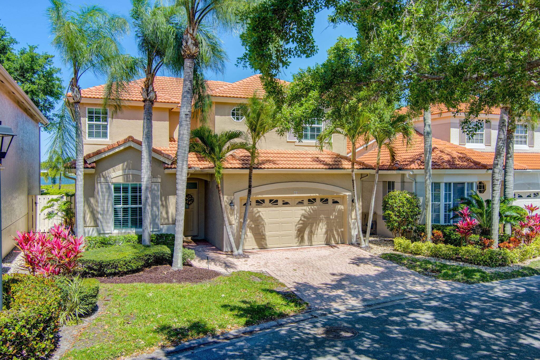 Breathtaking Golf Lake Resort views from this beautifully remodeled 4BR 3BA loft home in the highly desirable community of Monterey Pointe in PGA National.