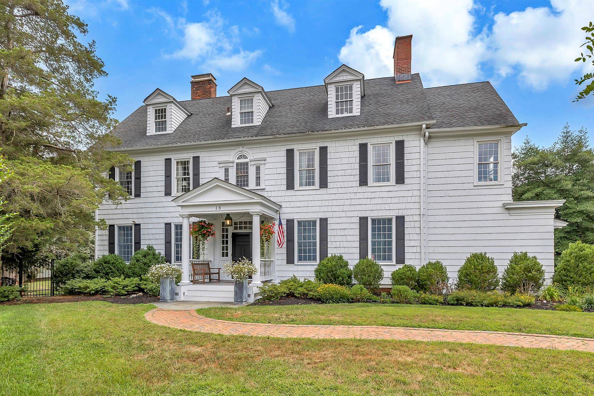 This Historic Center Hall Colonial, set on over an acre and a half on a quiet cul de sac is an oasis, with a private yard surrounded by protected woodlands.