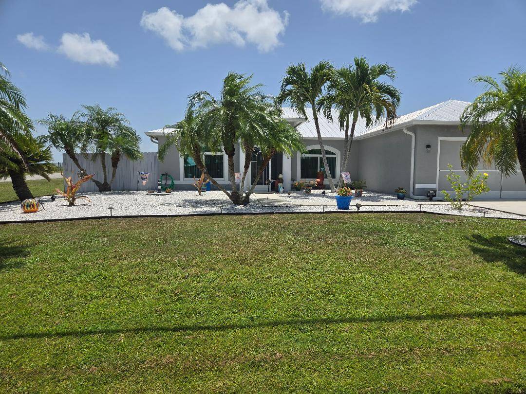 AMAZING WATERFRONT LOCATION on DOUBLE LOT with NEW SALTWATER SOLAR HEATED POOL !