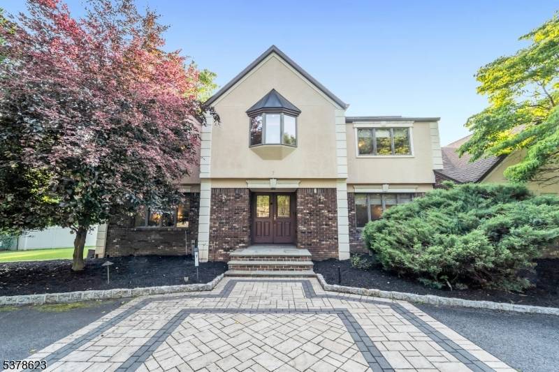Welcome to 7 Herbst Road, a beautifully maintained center hall colonial nestled on a quiet cul de sac in desirable Old Tappan.
