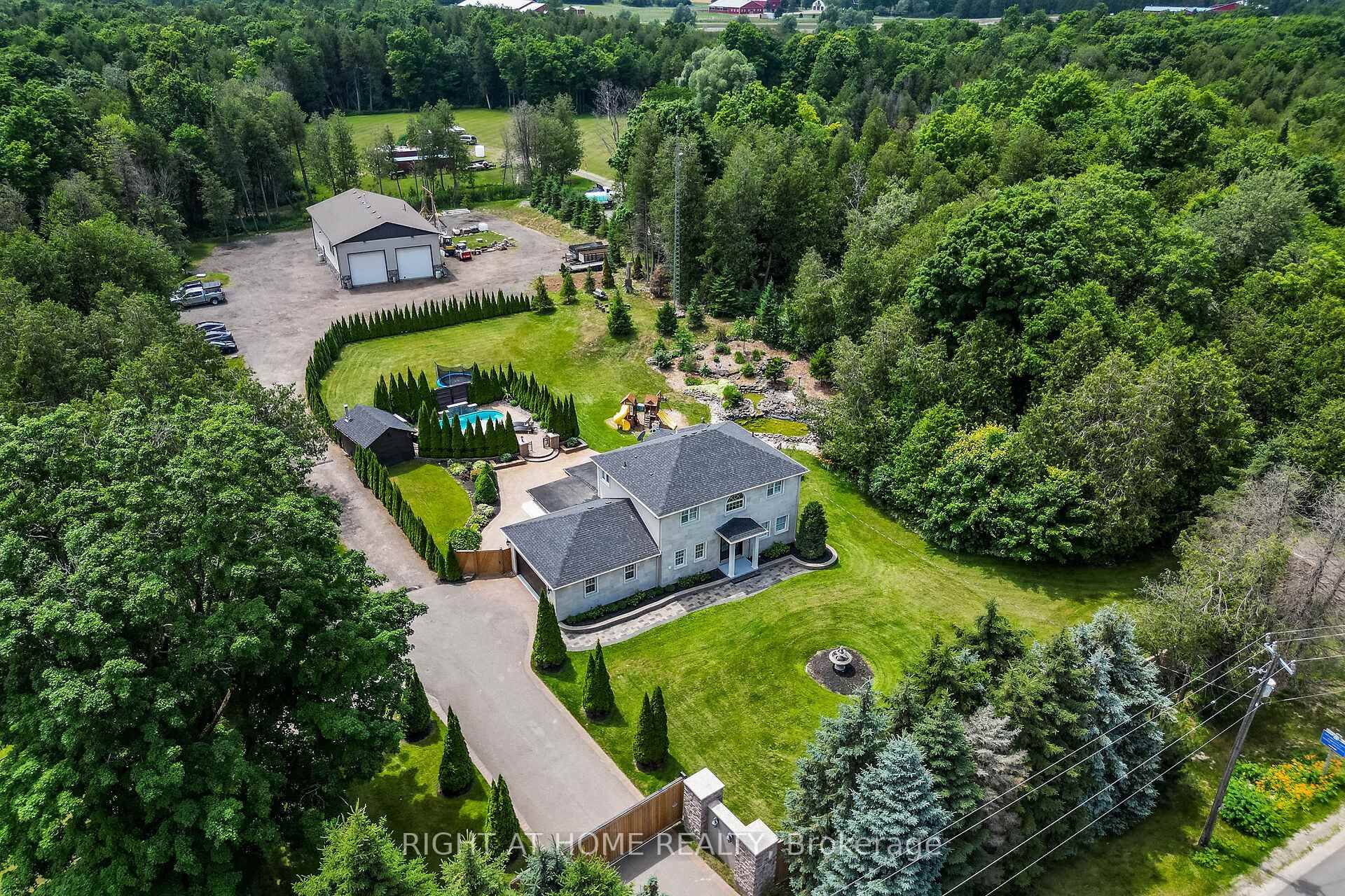 Welcome To 13640 Guelph Line, A Stunning Custom Estate Nestled On 2 Serene Acres !