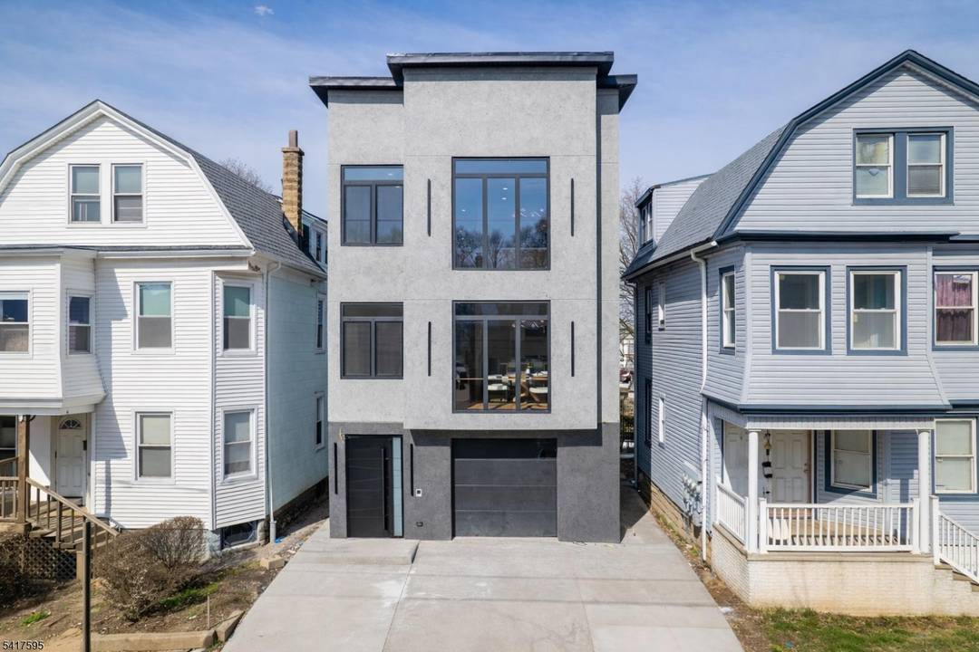 A statement of sophistication and craftsmanship, this custom new construction two family residence redefines modern living in Irvington, NJ.