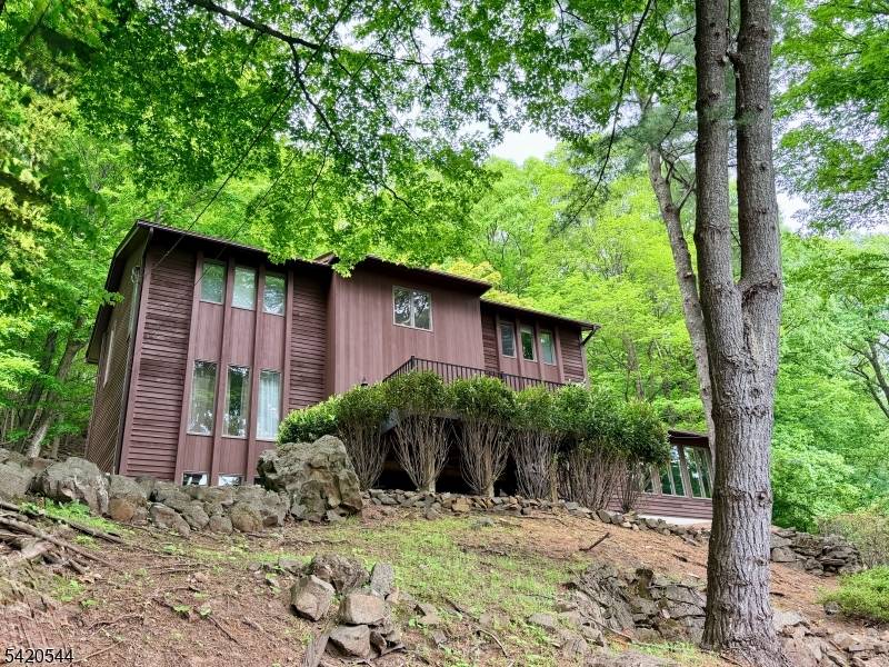 Stunning contemporary in a gorgeous natural setting, with tastefully renovated kitchen and bathrooms.