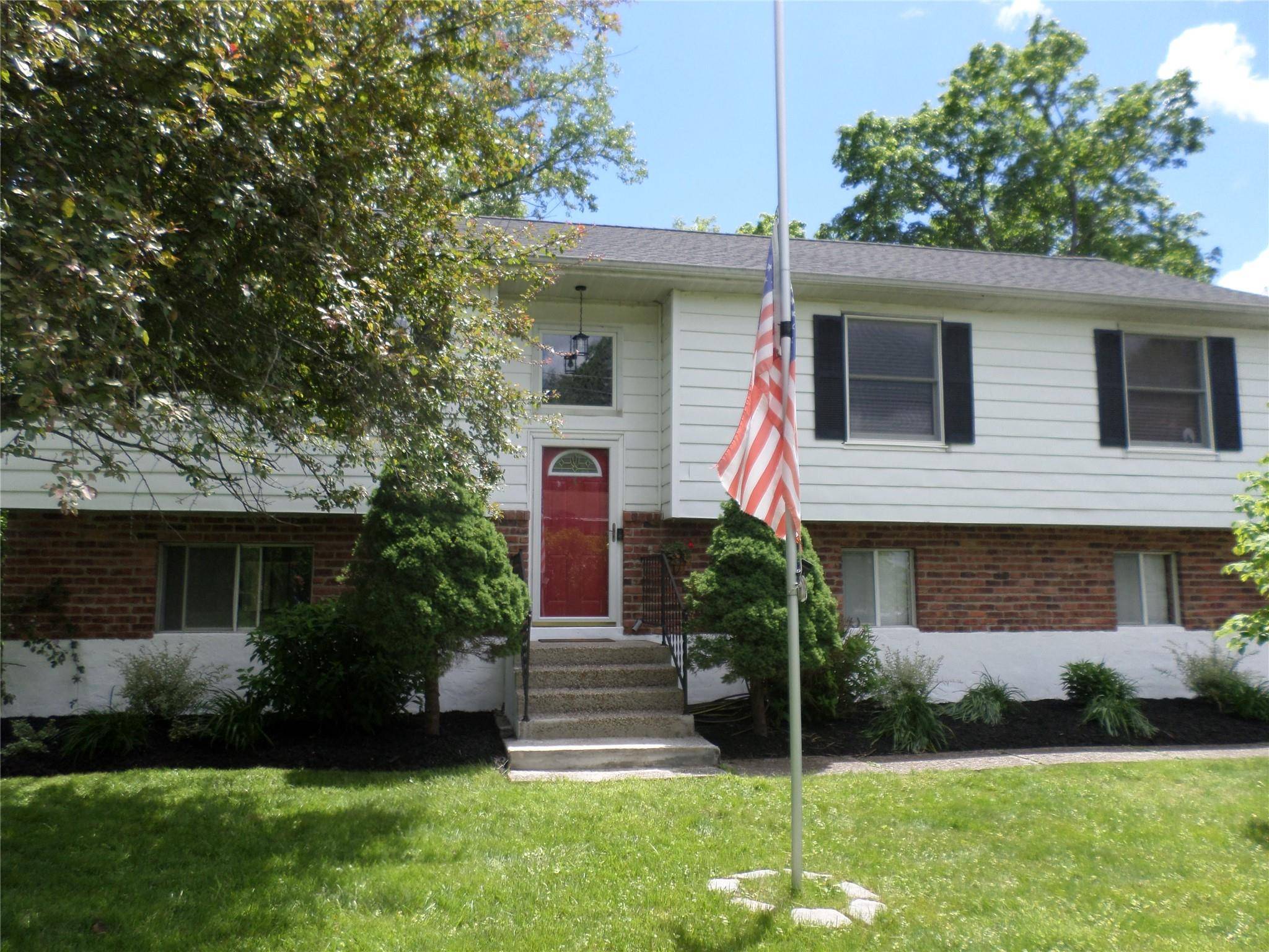 Filled with natural light amp ; peaceful surroundings, move right into this 3 bedroom, 2 bath home on a level third of an acre.
