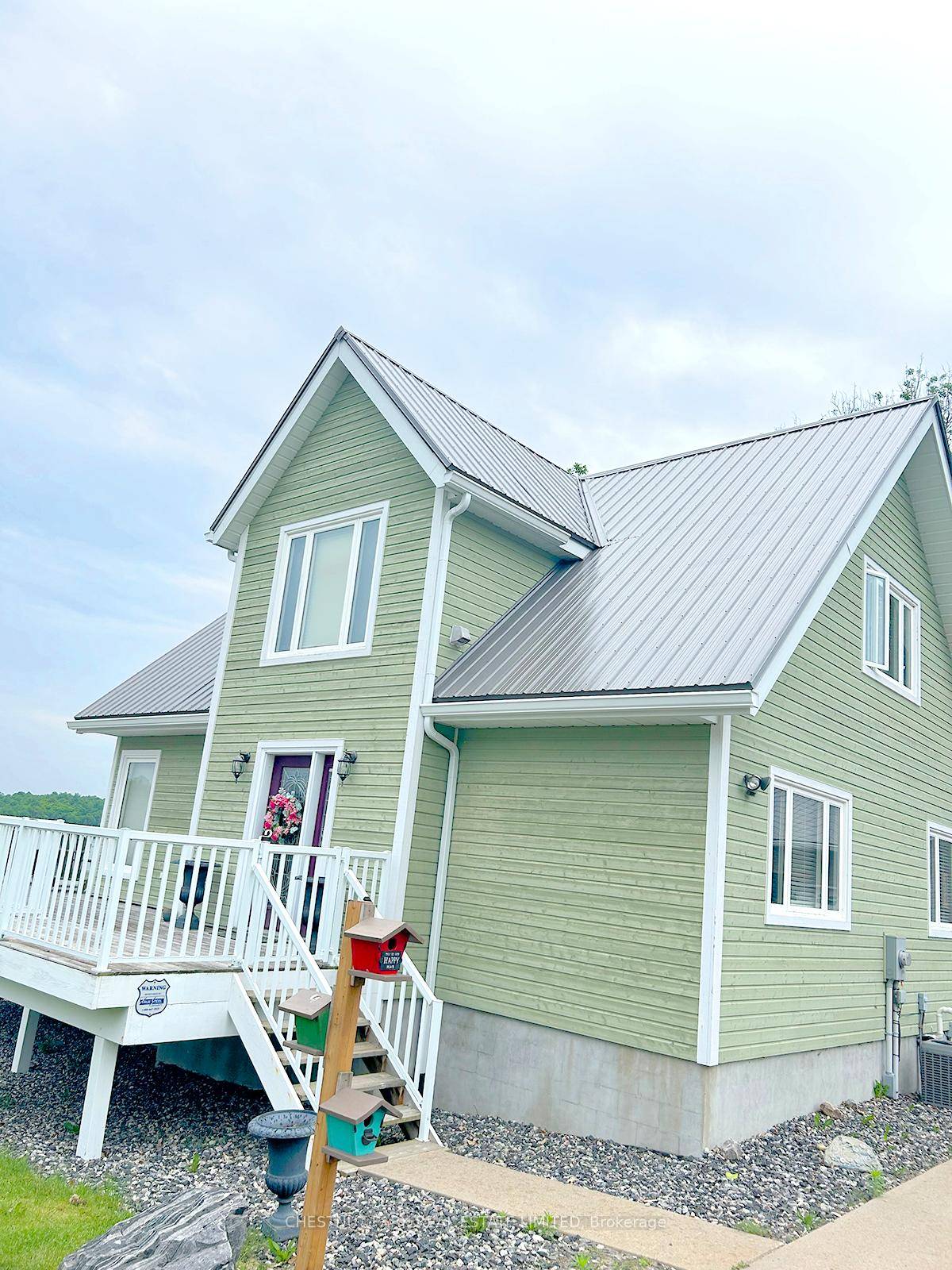 Superb quality, well designed custom home, with majestic, long views down Wilson Lake, and a dreamy 30 x 42 garage workshop art studio.
