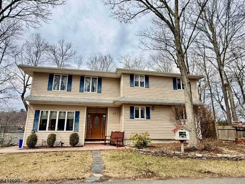 Spectacular Lake Views from nearly every angle in this beautifully positioned home in Upper Greenwood Lake.