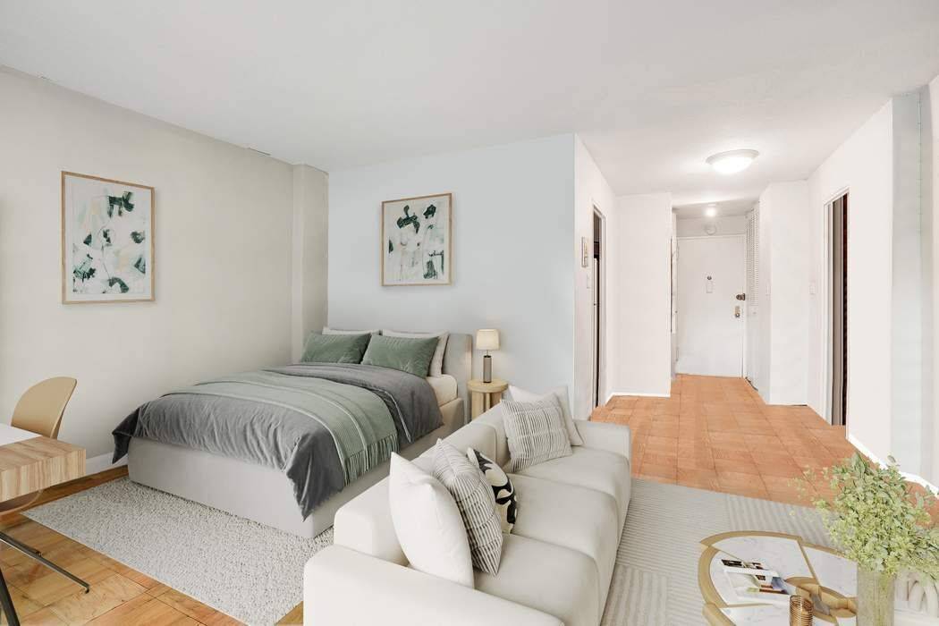 Perched on the 11th floor, this extra large alcove studio offers a rare combination of light, views, and intelligent design.