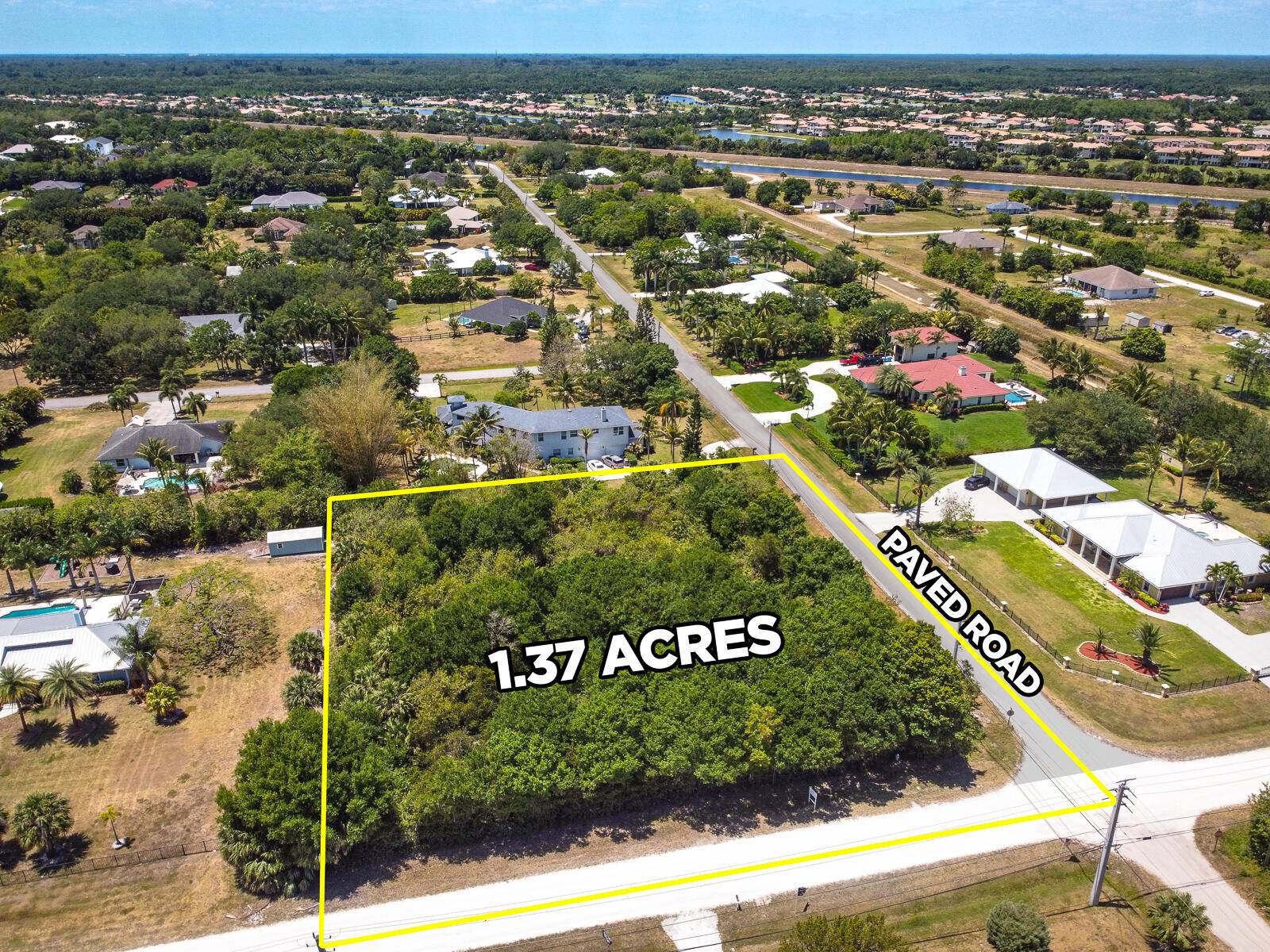This beautiful 1. 37 acre corner lot is one of the last remaining vacant parcels on a paved road in Palm Beach Country Estates.