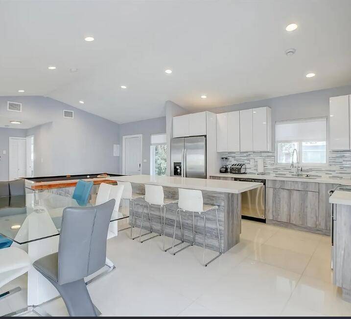 Discover this stunning one story pool home retreat in the heart of Fort Lauderdale's desirable Lake Aire Palm View neighborhood.