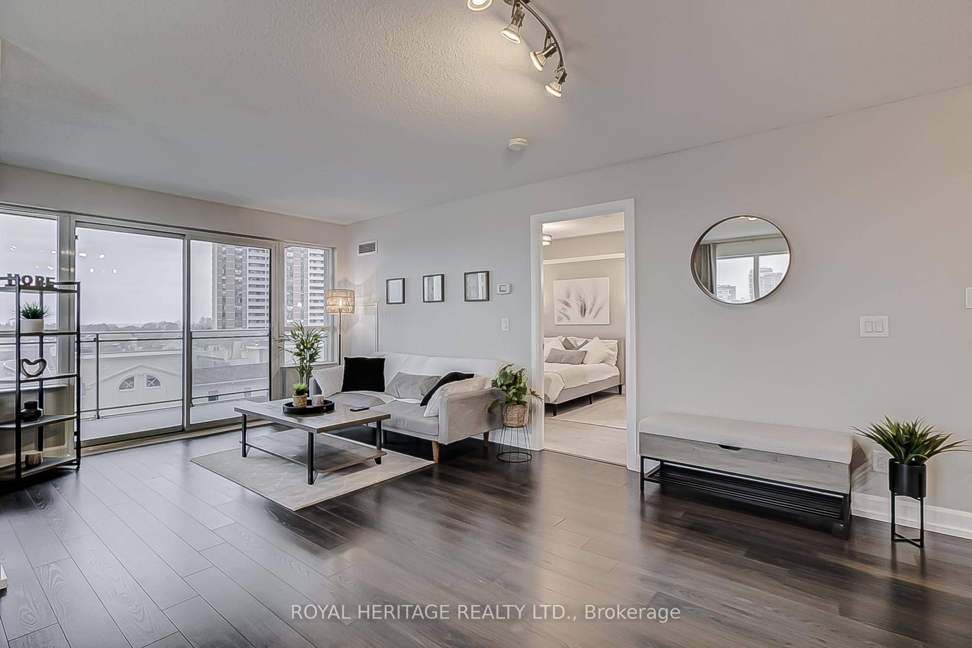 CORNER UNIT with Large Wrap Around Balcony with partial lake views.