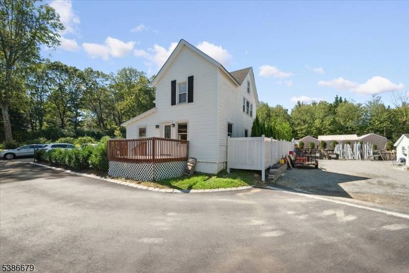 Welcome to this beautifully updated Colonial in Randolph, offering a rare mixed use opportunity on 1.