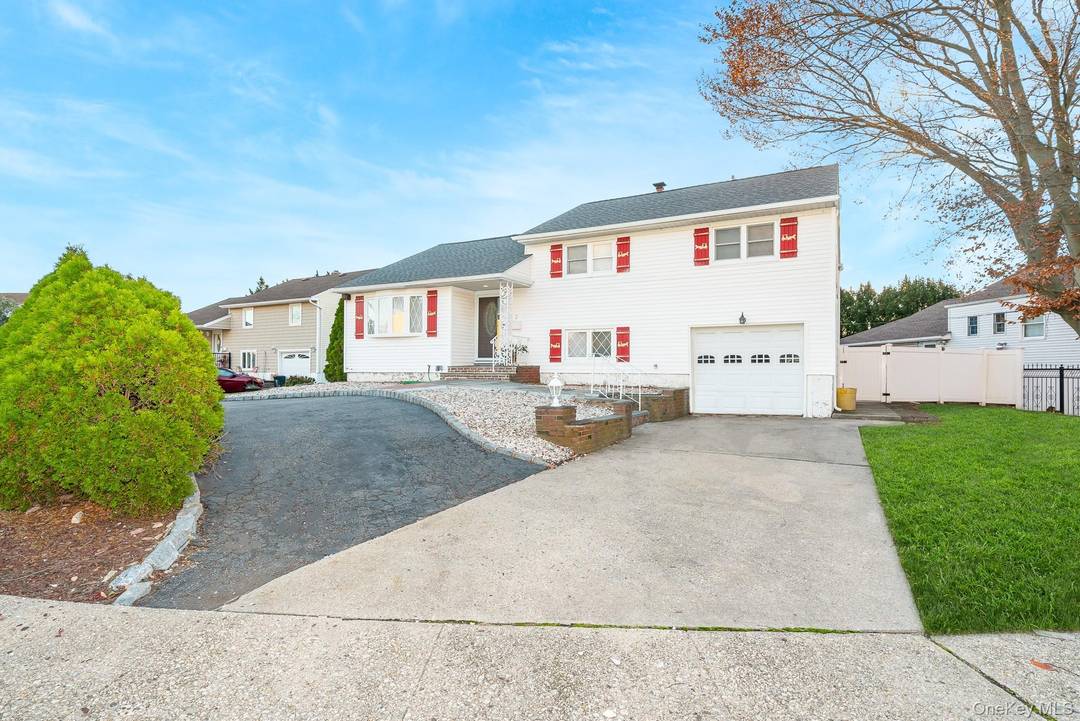 Welcome home to 3 Brewster Gate in North Massapequa a well maintained split level home with many new updates.