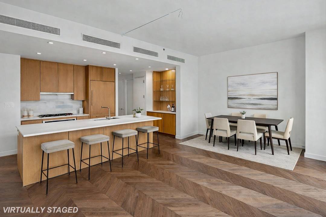 This 1402 square foot two bedroom, two bath plus powder room is bathed in northern light from dramatic oversized divided light windows.